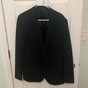 J Ferrar Slim Fit Black Suit. Jacket Size: 44R Slim Fit. Pants Size: 34x32.